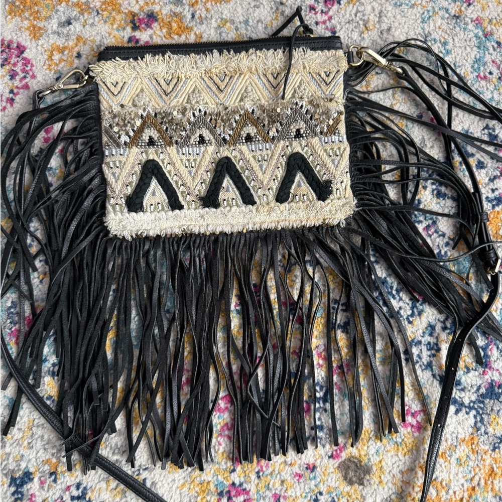 Rebecca Minkoff  black leather fringe purse with beaded details.